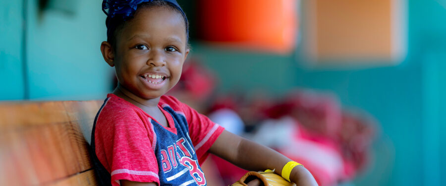Young Dana-Farber patient in Red Sox gear at Fenway Park